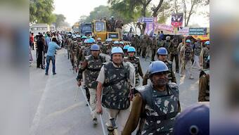 Frustrated police attack media as Godman Rampal continues standoff