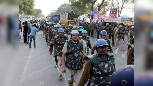 Frustrated police attack media as Godman Rampal continues standoff