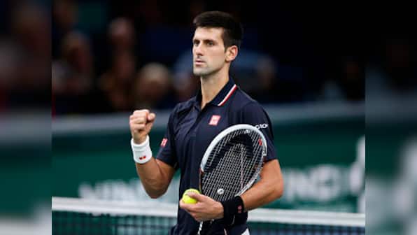 Injured Tomic gifts Djokovic spot in Indian Wells semis