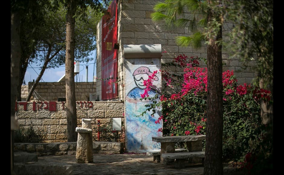 A piece of the Berlin Wall is seen in the artists' village of Ein Hod near Haifa in Israel October 17, 2014. On November 9, Germany will celebrate the 25th anniversary of the fall of the Berlin Wall. To mark the event Reuters Photographers around the world captured images of segments of the wall, which are kept as monuments in many countries from Taiwan to South Africa and Costa Rica. The Berlin Wall, which divided West Berlin from the communist East after it was built in 1961, was the most potent symbol of the Cold War. At least 136 people were killed or died at the Wall, most of them while trying to escape. On November 9, 1989, following huge protests in East Berlin the wall was breached and thousands of people poured into West Berlin. Picture taken October 17, 2014. REUTERS/Baz Ratner (ISRAEL - Tags: SOCIETY ANNIVERSARY CONFLICT) ATTENTION EDITORS - PICTURE 05 OF 32 FOR WIDER IMAGE STORY 'THE BERLIN WALL AROUND THE WORLD' SEARCH '25 BERLIN' FOR ALL IMAGES - RTR4CLOZ