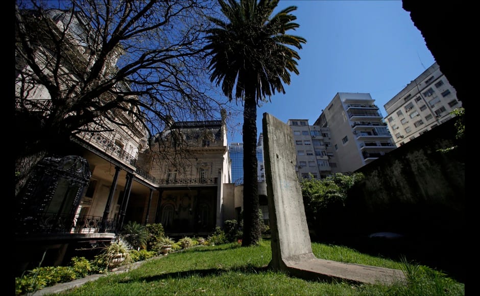 A piece of the Berlin Wall is seen at a garden inside San Martin palace, headquarters of Argentina's Foreign Ministry in Buenos Aires September 12, 2014. On November 9, Germany will celebrate the 25th anniversary of the fall of the Berlin Wall. To mark the event Reuters Photographers around the world captured images of segments of the wall, which are kept as monuments in many countries from Taiwan to South Africa and Costa Rica. The Berlin Wall, which divided West Berlin from the communist East after it was built in 1961, was the most potent symbol of the Cold War. At least 136 people were killed or died at the Wall, most of them while trying to escape. On November 9, 1989, following huge protests in East Berlin the wall was breached and thousands of people poured into West Berlin. Picture taken September 12, 2014. REUTERS/Marcos Brindicci (ARGENTINA - Tags: SOCIETY ANNIVERSARY CONFLICT) ATTENTION EDITORS - PICTURE 27 OF 32 FOR WIDER IMAGE STORY 'THE BERLIN WALL AROUND THE WORLD' SEARCH '25 BERLIN' FOR ALL IMAGES - RTR4CLPO