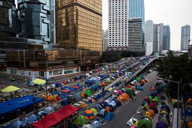 Protesters and tents occupy the main road. Reuters