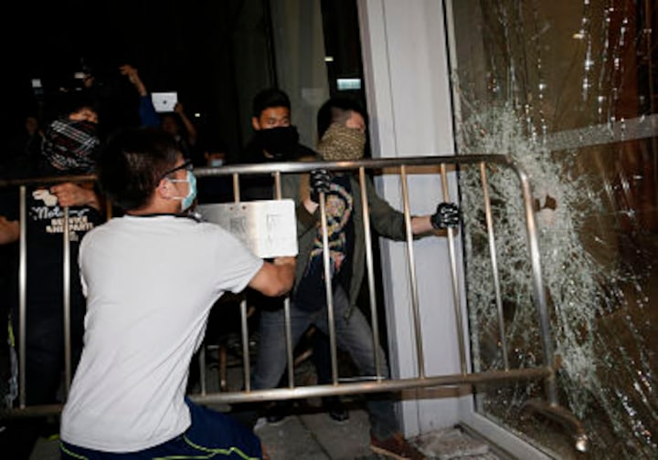 Hong Kong: Clashes erupt as protesters attempt to break into city's legislature
