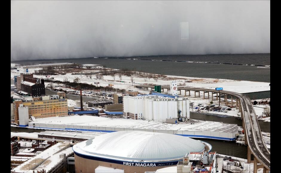 A lake-effect snow storm with freezing temperatures produces a wall of snow travelling over Lake Erie into Buffalo, New York. November 18, 2014. A whirlpool of frigid, dense air known as a 
