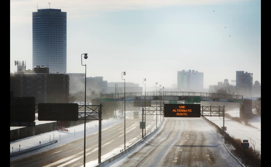 Snow blows across Route 190 in Buffalo, New York, November 19, 2014. An autumn blizzard dumped a year's worth of snow in three days on Western New York state, where five people died and residents, some stranded overnight in cars, braced for another pummeling expected later on Wednesday. REUTERS