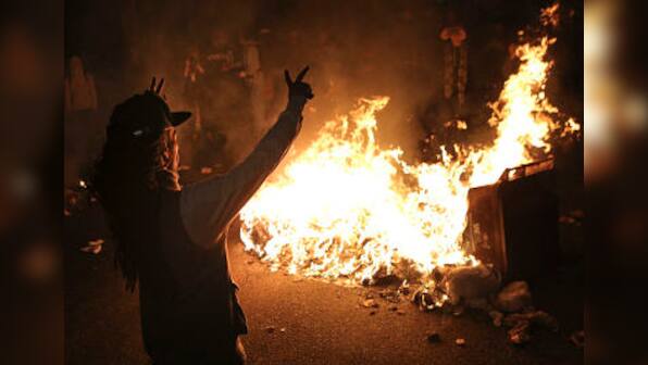 Ferguson shooting: 12 buildings torched as protests intensify