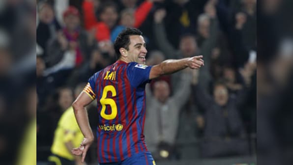 Xavi integral to struggling Barca says Coach