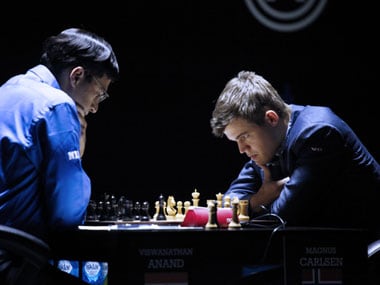 Vishwanath Anand and Magnus Carlsen looking back at one another. : r/chess