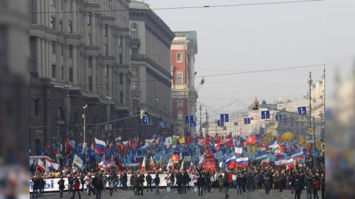 Russians march in defiance of West and display of unity – Firstpost