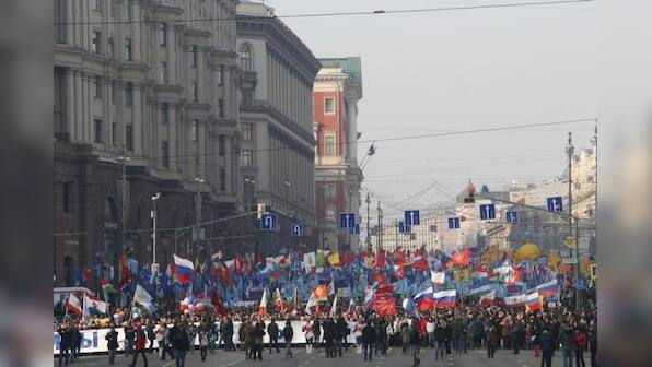 Russians march in defiance of West and display of unity – Firstpost
