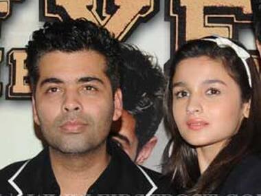 Director and producer Karan Johar with actor Alia Bhatt