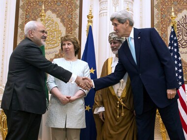 US Secretary of State John Kerry with Iranian foreign minister Javad Zarif in Muscat. Reuters
