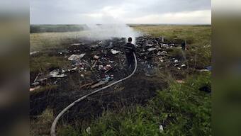 MH17 crash: Human remains found at site but no wreckage recovered