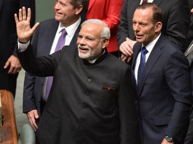 PM Modi with Tony Abbott. AFP.