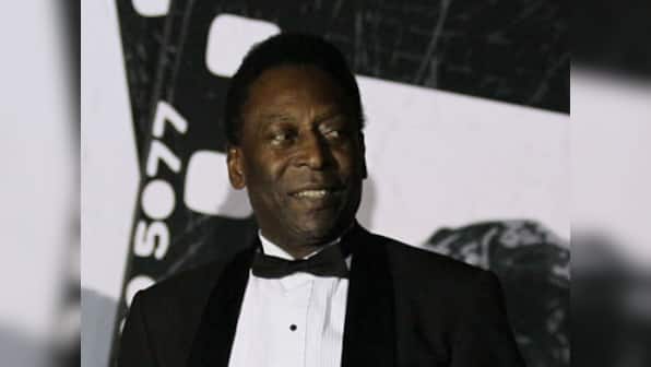 Football great Pele stable but still in hospital