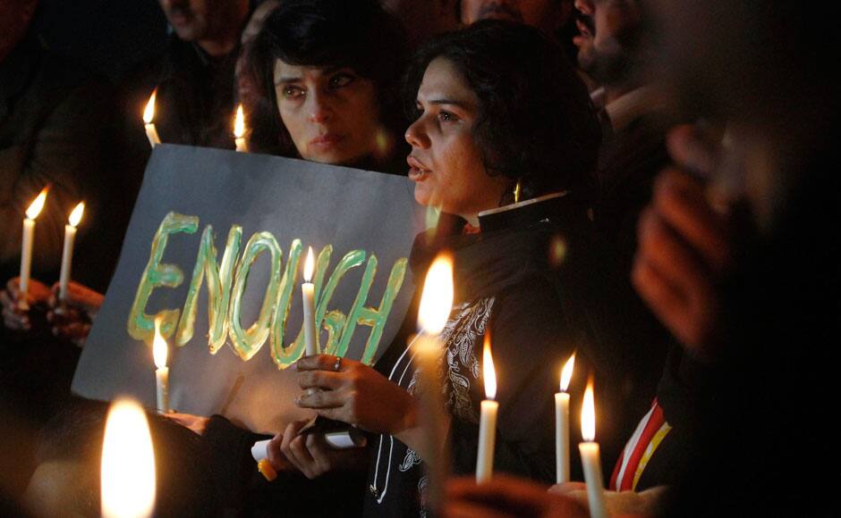 Pakistani civil society members take part in a candle light vigil for the victims of a school attacked by the Taliban in Peshawar, Tuesday, Dec. 16, 2014 in Islamabad, Pakistan. Taliban gunmen stormed a military-run school in the northwestern Pakistani city, killing more than 100 people, officials said, in the worst attack to hit the country in years.(AP Photo/Anjum Naveed)