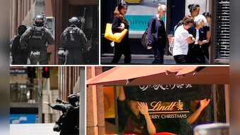  Sydney siege: Hostages held in a cafe, made to hold up Islamic flags