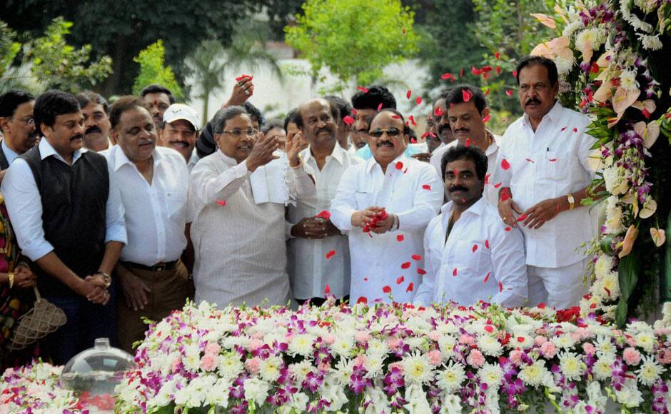 Bengaluru : Karnataka Chief Minister Siddaramaiah paying floral tribute as actors Rajinikant and Chiranjivi look on during the inauguration of Dr Rajkumar’s Memorial in Bengaluru on Saturday. Spread across 2.5 acres, the memorial is supposed to be the biggest built for any cine actor in the country. PTI 