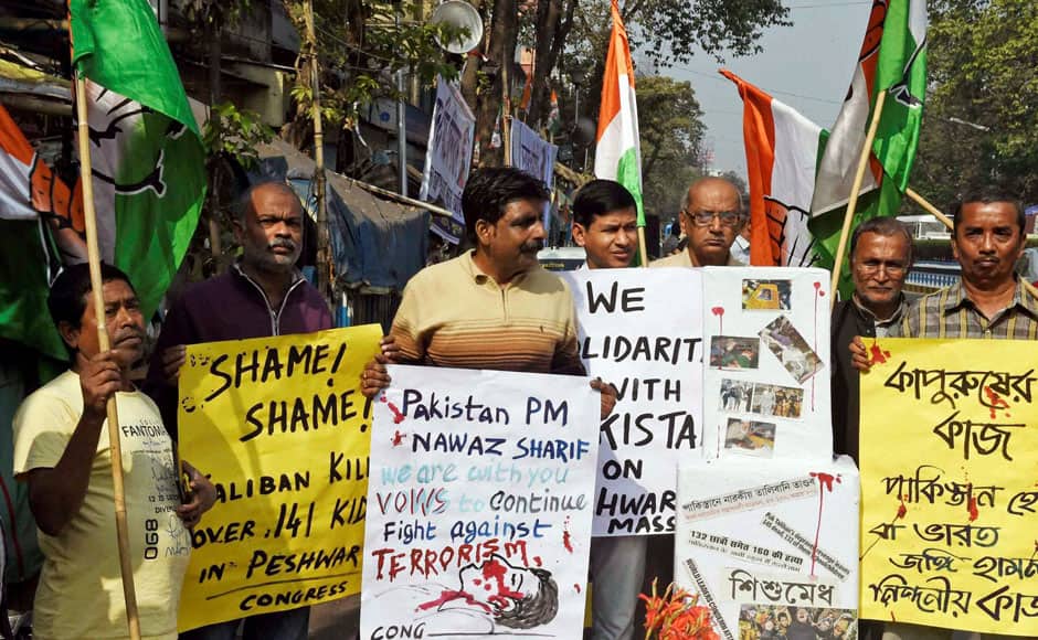 Kolkata: Congress activists holding placards during a protest rally in Kolkata on Wednesday against the Pakistan terror attack on School students. PTI 