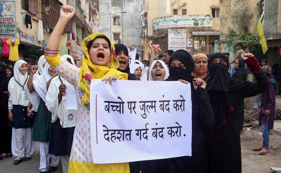 Thane: School girls holding placards during a protest rally in Thane on Wednesday against the Pakistan terror attack on School students. PTI 