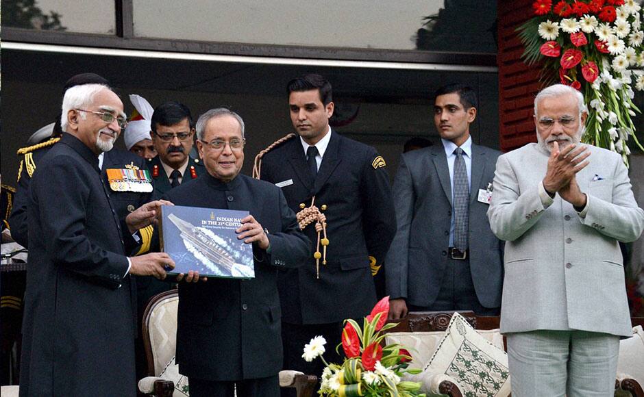 New Delhi: President Pranab Mukherjee, Vice President Hamid Ansari and PM Narendra Modi at the Navy Day reception hosted by the Chief of the Naval Staff Admiral RK Dhowan at Navy House in New Delhi on Thursday. PTI 