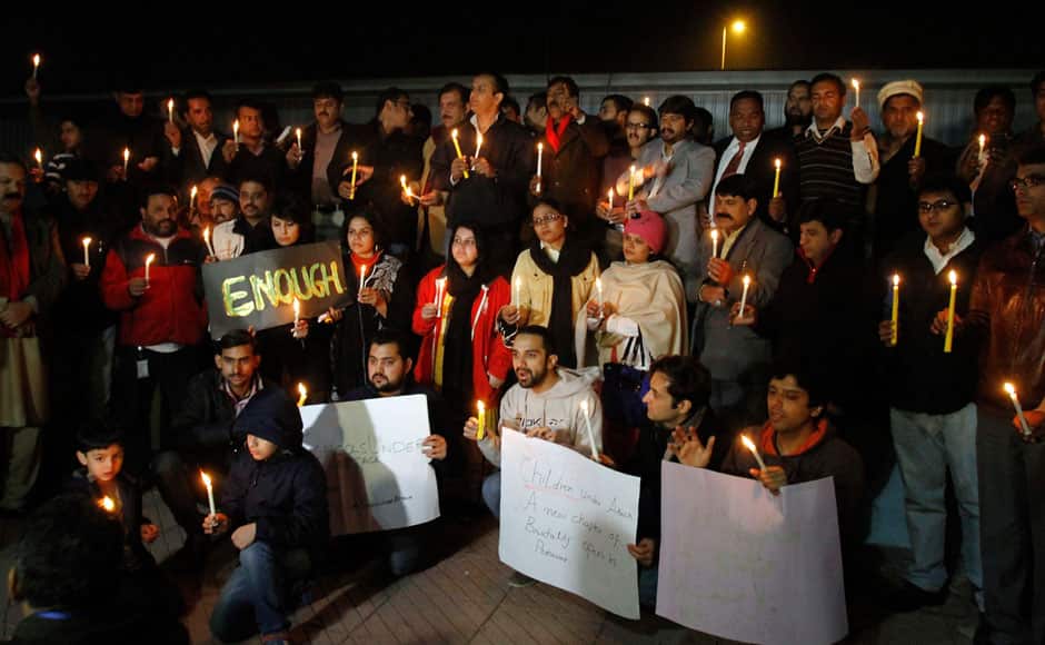 Pakistani civil society members take part in a candle light vigil for the victims of a Taliban attack on a school in Peshawar, Tuesday, Dec. 16, 2014 in Islamabad, Pakistan. Taliban gunmen stormed a military-run school in the northwestern Pakistani city, killing more than 100 people, officials said, in the worst attack to hit the country in years.(AP Photo/Anjum Naveed)(AP Photo/Anjum Naveed)