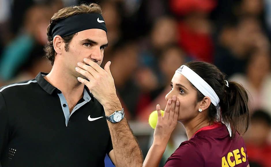 New Delhi: Micromax India Aces, Sania Mirza and Roger Federer during their mix doubles match against Singapore Slammers at the International Premier Tennis League (IPTL) at IGI stadium in New Delhi on Sunday. PTI
