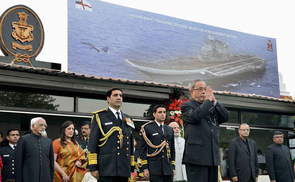 New Delhi: President Pranab Mukherjee attending the Navy Day reception hosted by the Chief of the Naval Staff Admiral RK Dhowan at Navy House in New Delhi on Thursday. Vice President Hamid Ansari and Prime Minister Narendra Modi are also seen. PTI