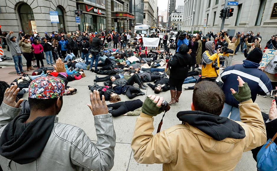 Demonstrators assume the 