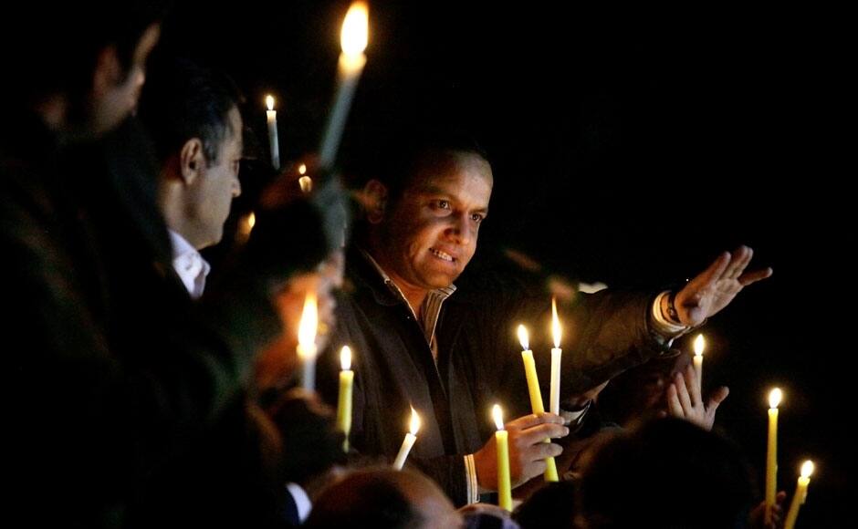 Pakistani journalists and civil society members hold a candle light vigil for the victims of a Taliban attack on a school, in Islamabad, Pakistan, Tuesday, Dec. 16, 2014. Taliban gunmen stormed a military-run school in the northwestern Pakistani city of Peshawar on Tuesday, killing more than 100, officials said, in the highest-profile militant attack to hit the troubled region in months. (AP Photo/Anjum Naveed)