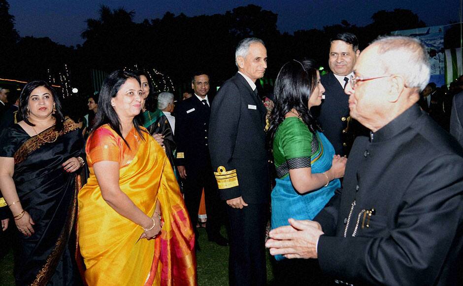 New Delhi: President Pranab Mukherjee attending the Navy Day reception hosted by the Chief of the Naval Staff Admiral RK Dhowan at Navy House in New Delhi on Thursday. PTI