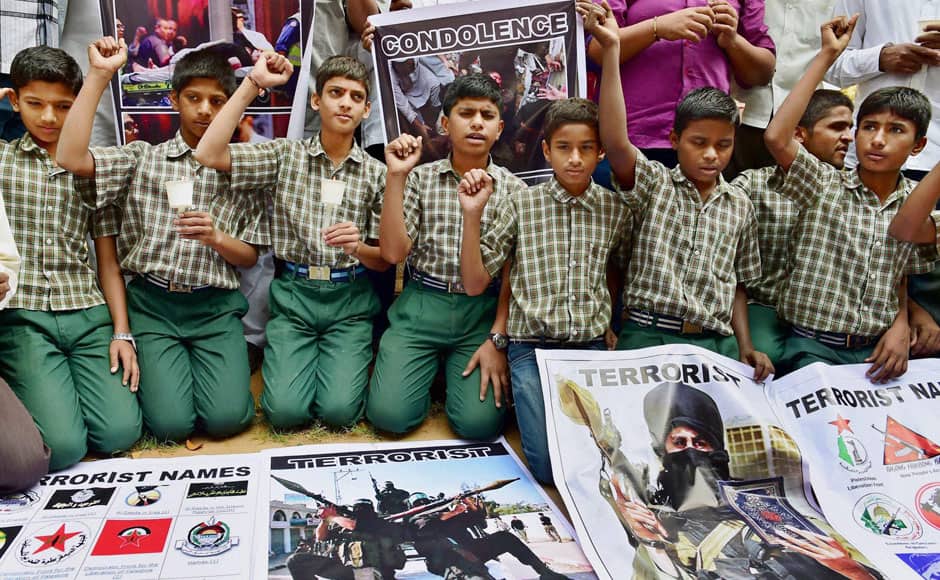 Bengaluru : Students shout slogans against terrorism at a programme to condemn the terror attack on an army school in Peshawar in Pakistan, in Bengaluru on Wednesday. PTI