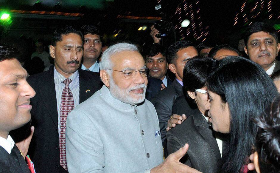 New Delhi: Ptime Minister Narendra Modi meeting the invitees at the Navy Day reception hosted by the Chief of the Naval Staff Admiral RK Dhowan at Navy House in New Delhi on Thursday. PTI 