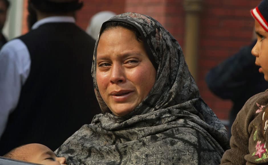 A Pakistani woman weeps as she waits at a hospital, where victims of a Taliban attack are being treated in Peshawar, Pakistan,Tuesday, Dec. 16, 2014. Taliban gunmen stormed a military-run school in the northwestern Pakistani city of Peshawar on Tuesday, killing and wounding scores, officials said, in the highest-profile militant attack to hit the troubled region in months.(AP Photo/Mohammad Sajjad) (AP Photo/Mohammad Sajjad)
