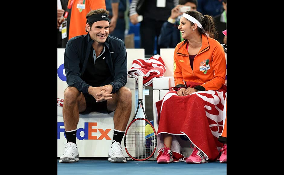New Delhi: Micromax India Aces, Sania Mirza and Roger Federer during their mix doubles match against Singapore Slammers at the International Premier Tennis League (IPTL) at IGI stadium in New Delhi on Sunday. PTI 