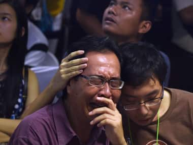 Relatives of those who died in the crash. AFP