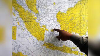 AirAsia flight QZ8501: Life raft, plane door spotted in sea, say officials