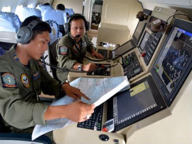 Indonesian air force pilots during a search mission for QZ8501. Reuters 
