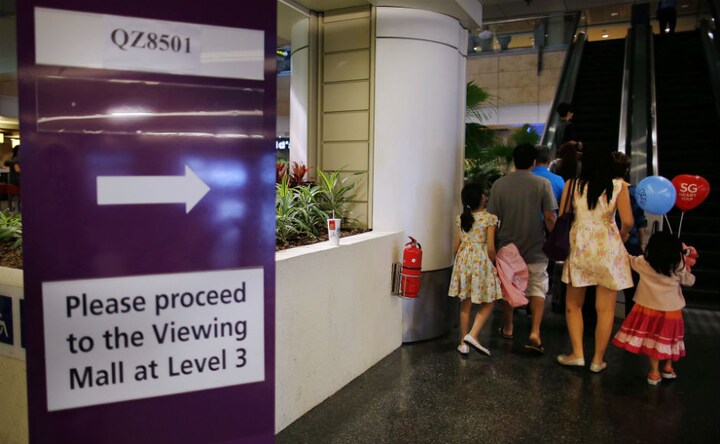 Photos: Anxious wait for relatives as search resumes for AirAsia flight QZ8501 