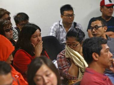 Family members of passengers who were on board the AirAsia QZ8501 flight. Reuters