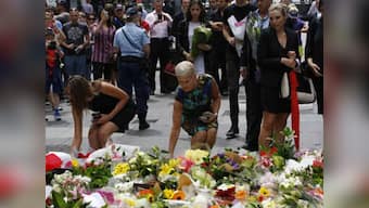 Sydney hostage crisis: Australia PM lays flowers at memorial for victims 