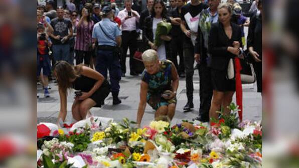 Sydney hostage crisis: Australia PM lays flowers at memorial for victims 