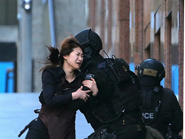 Sydney siege: 5 hostages escape from Lindt cafe, negotiations on with gunman Sydney siege: 5 hostages escape from Lindt cafe, negotiations on with gunman