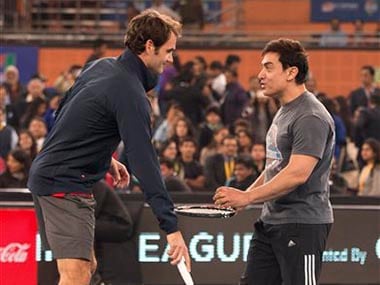 Bollywood actor Aamir Khan shares a lighter moment with Roger Federer . AP