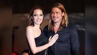 In sickness and in health: Brad Pitt promotes 'Unbroken' on behalf of unwell Jolie