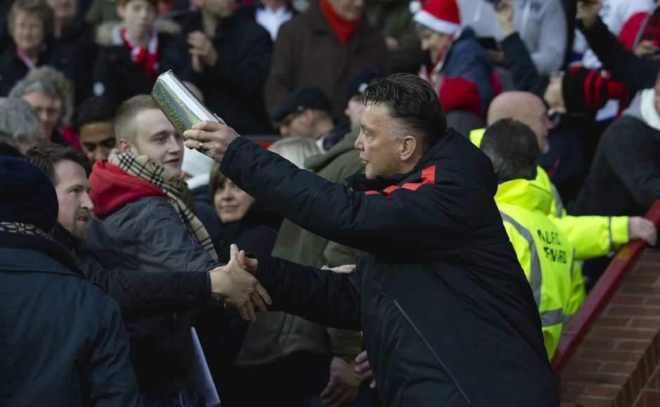 Taskmaster Van Gaal turns Santa Claus for surprised Man United fans Taskmaster Van Gaal turns Santa Claus for surprised Man United fans
