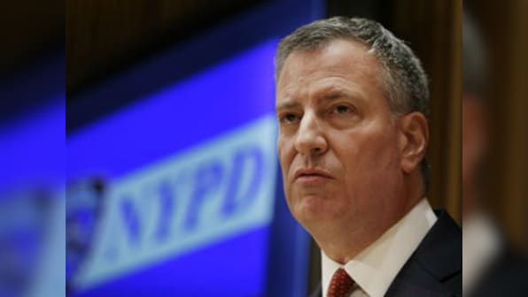 Battered New York mayor calls for temporary halt to wave of protests