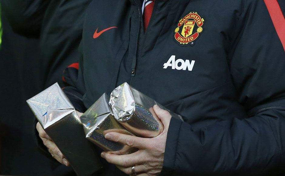 Van Gaal walked out with a few presents before kick-off between Man Utd and Newcastle at Old Trafford. Reuters