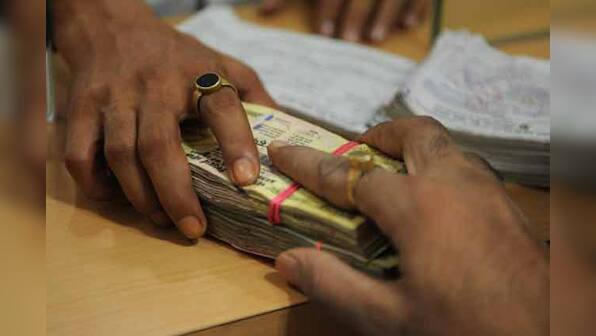 Rupee down marginally due to dollar demand from importers, banks