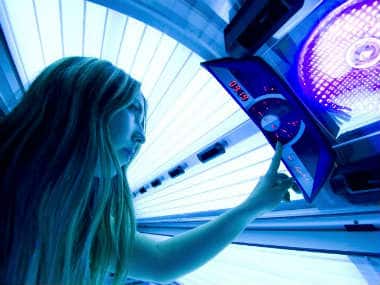 A woman goes into the tanning bed in this file photo. AFP 